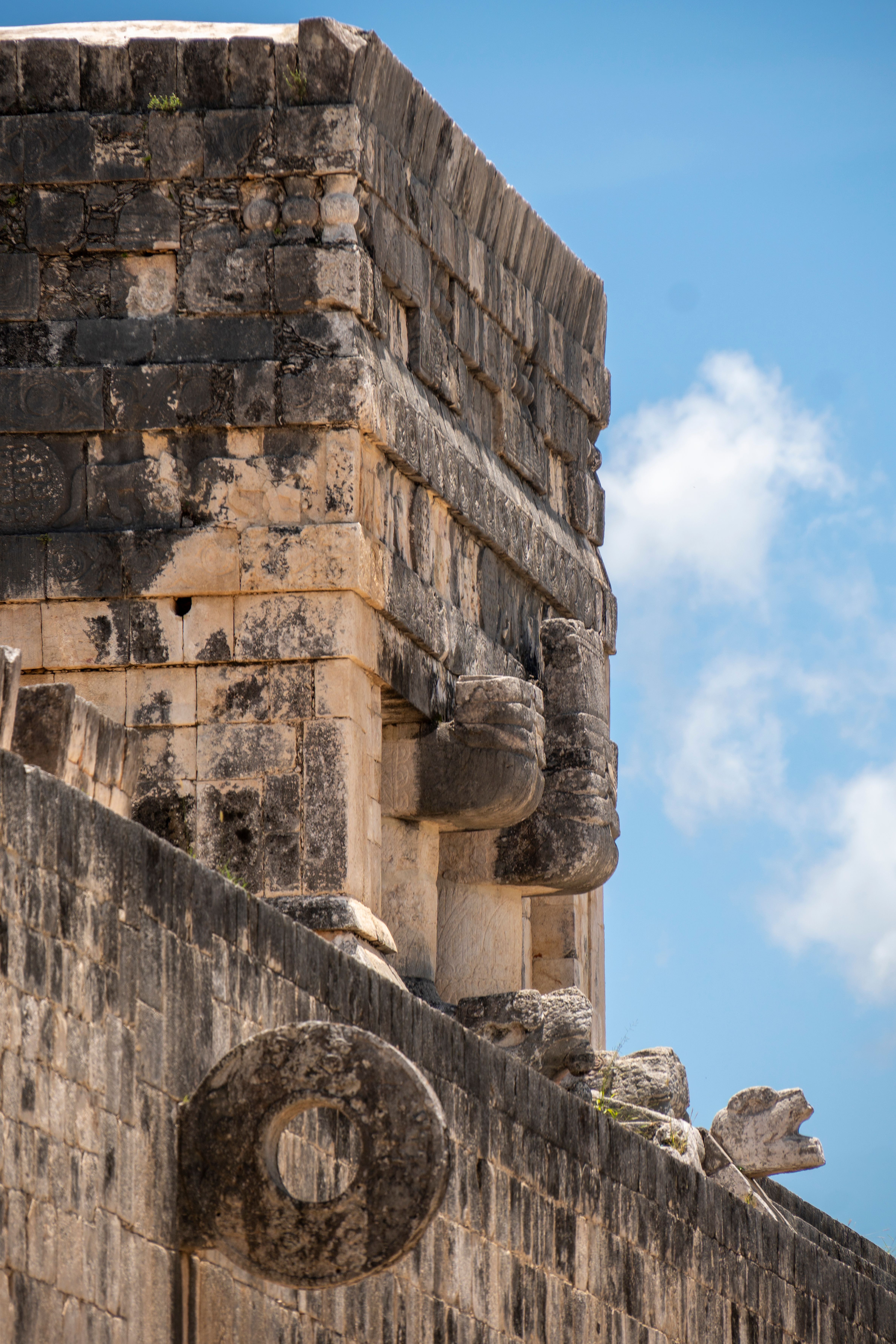 Detailed view of Kukulkan Pyramid's stone carvings in Chichén Itzá, Mexico.