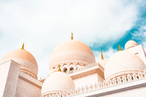 Free Stunning view of Sheikh Zayed Grand Mosque domes in Abu Dhabi under a clear blue sky. Stock Photo