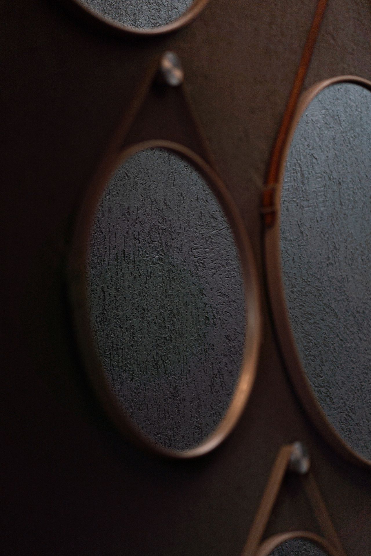 Group of decorative mirrors arranged on an entryway wall Group of decorative mirrors arranged on an entryway wall