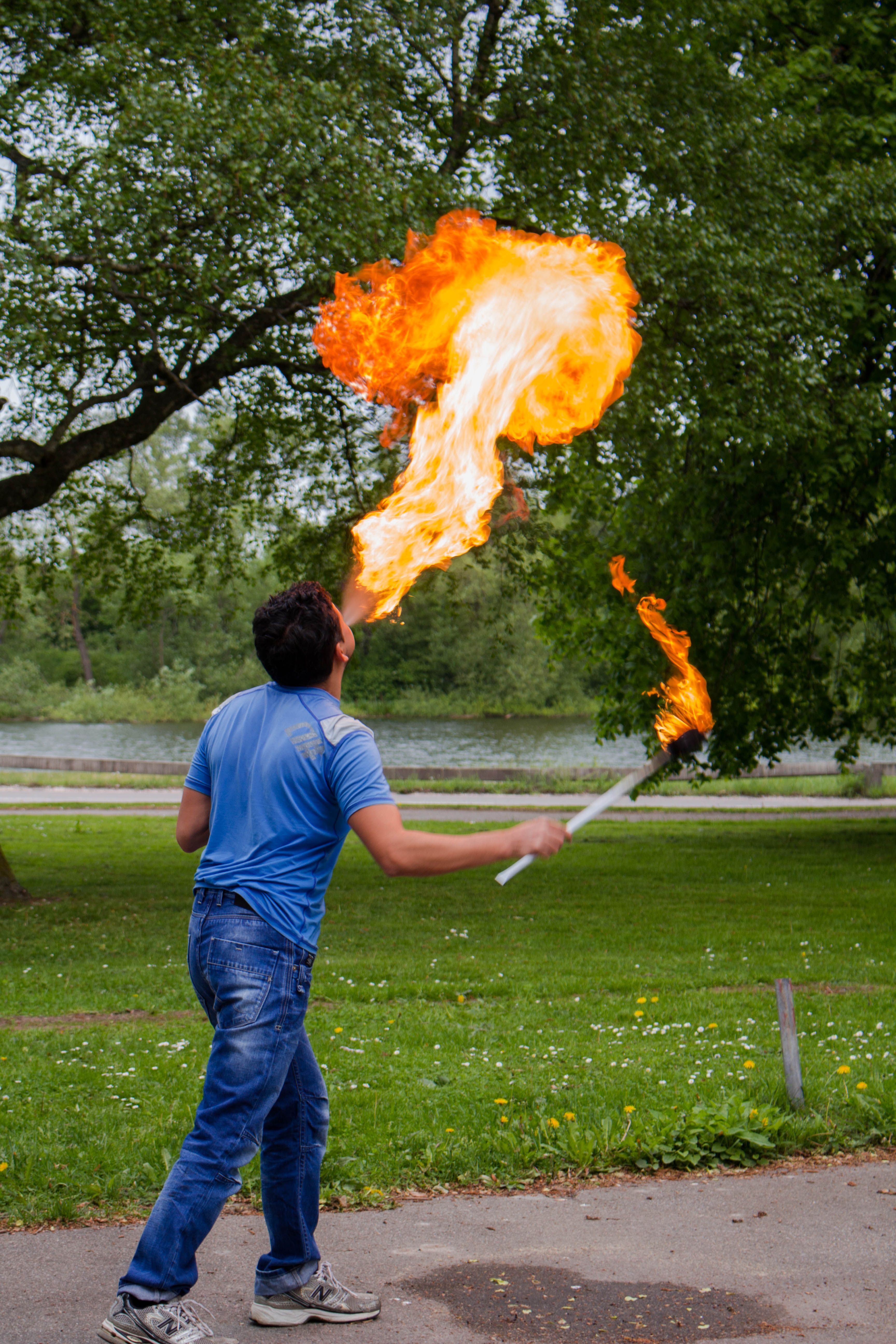 Man Spitting Fire at Park · Free Stock Photo