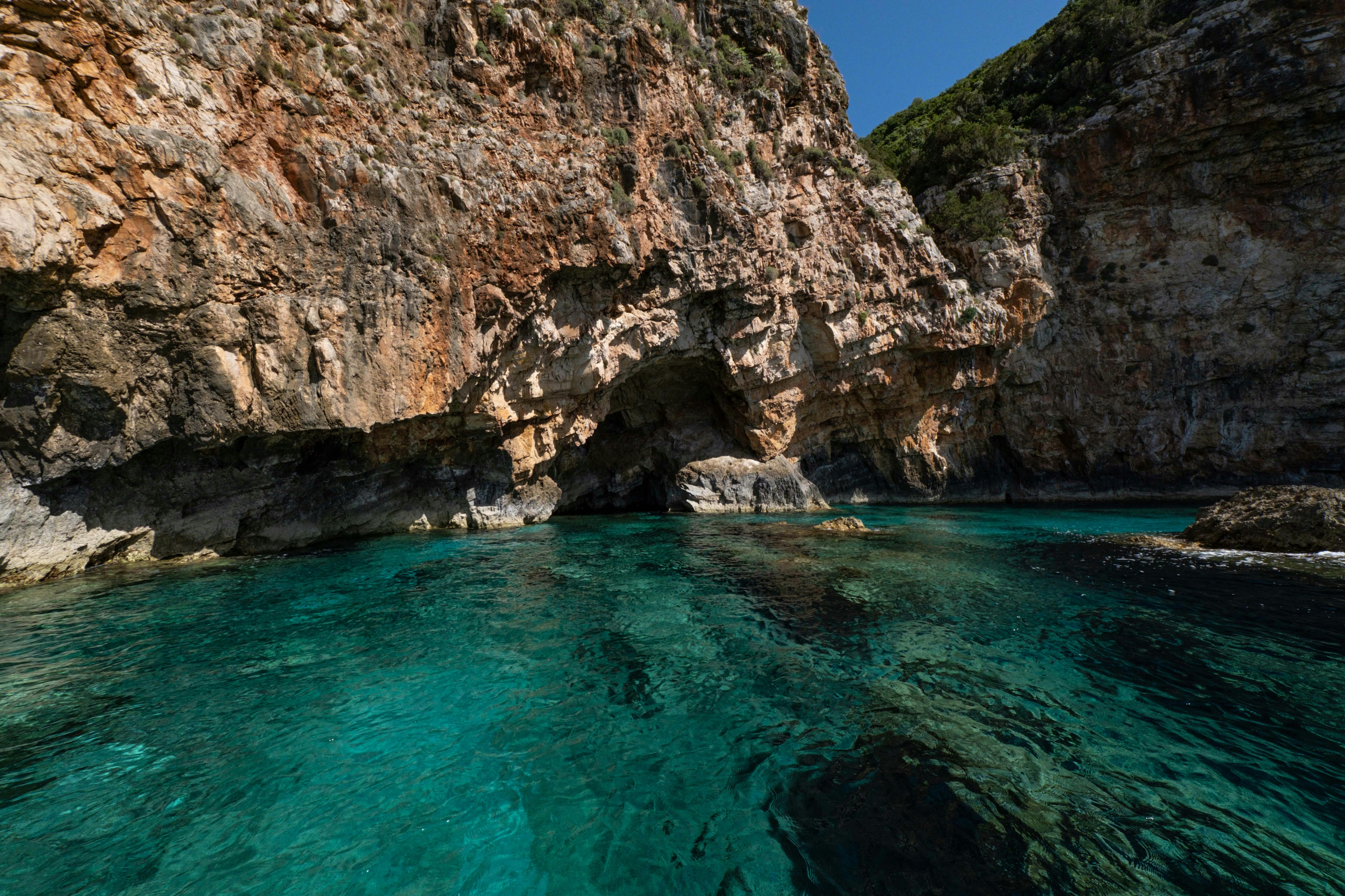 Explore a stunning coastal scene with vibrant turquoise water and rugged cliffs, perfect for travel inspiration.