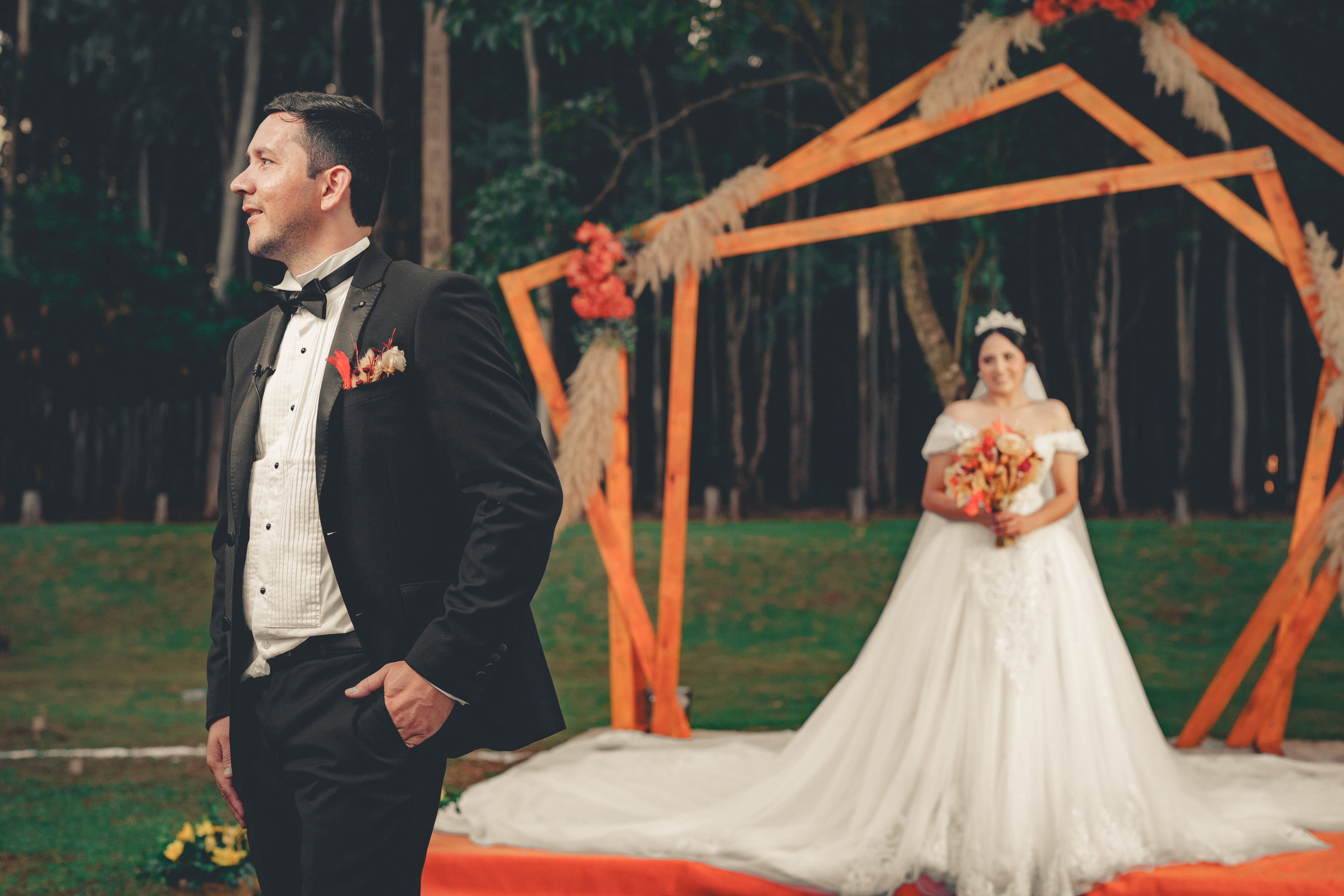 best wedding planner in cairo — Stunning bride and groom portrait at outdoor wedding ceremony in a beautiful forest setting.