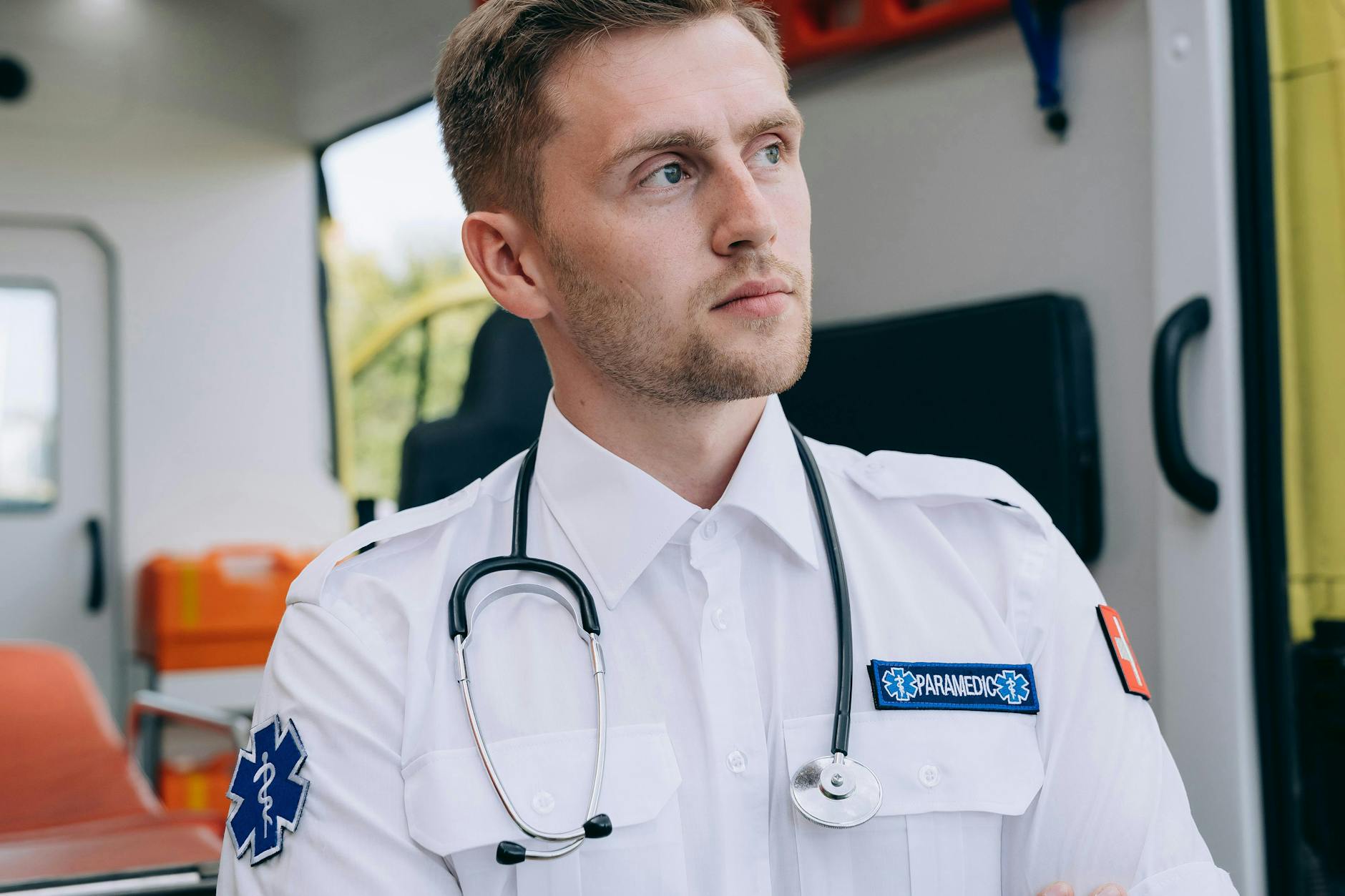 https://www.pexels.com/photo/paramedics-with-stethoscope-standing-in-front-of-an-open-ambulance-28123670/