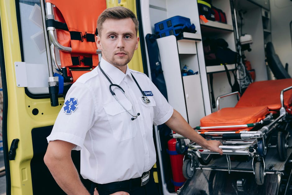 Healthcare worker operating a modern gurney - stretcher vs gurney Healthcare worker operating a modern gurney - stretcher vs gurney