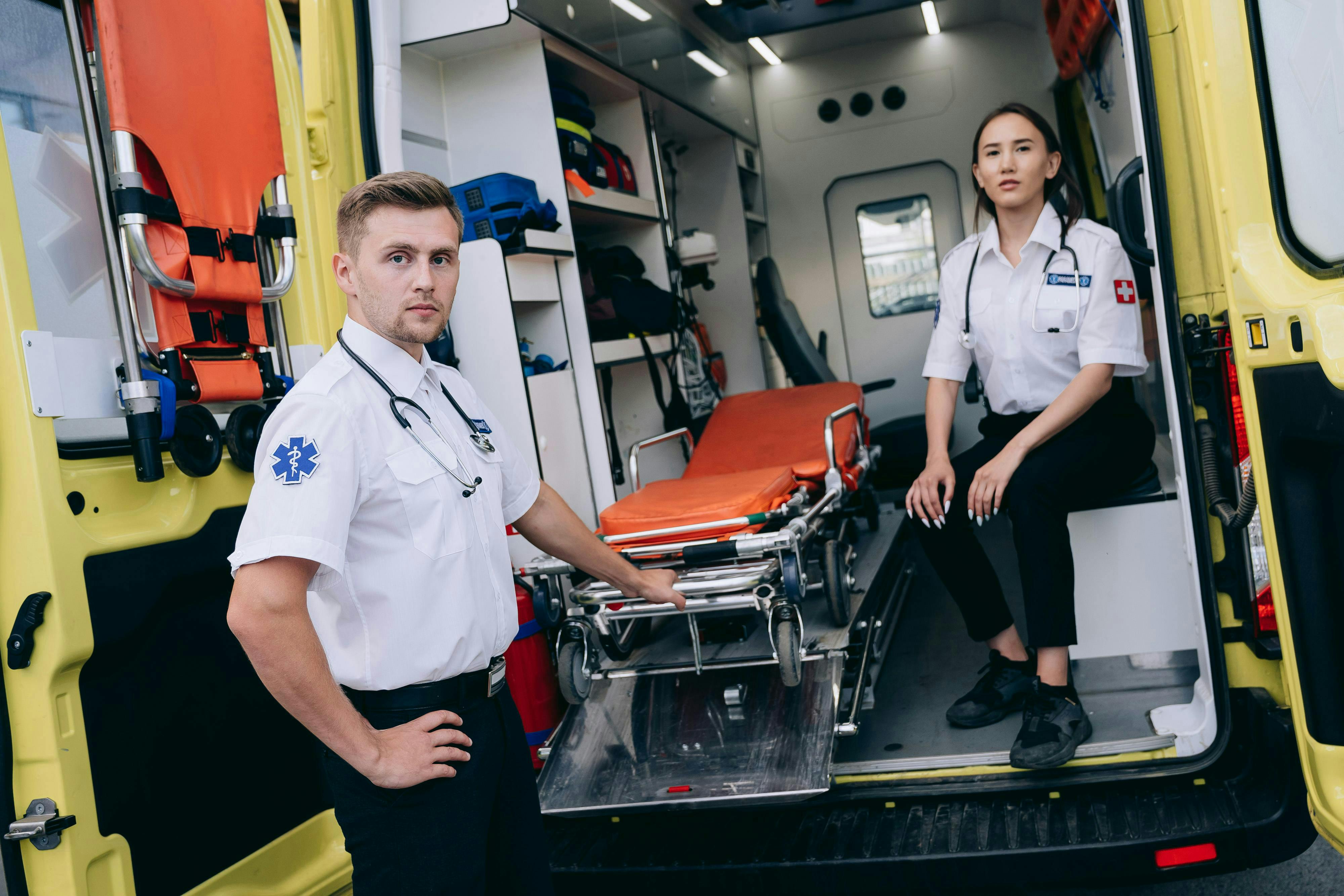 paramedics pulling a stretcher out of an ambulance