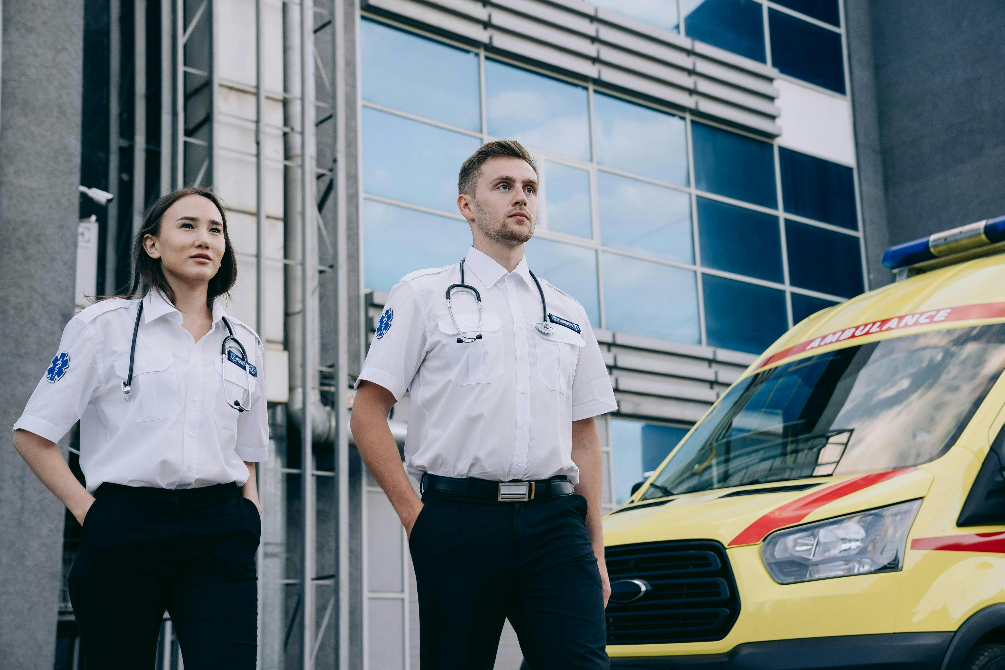 paramedics standing in white shirts