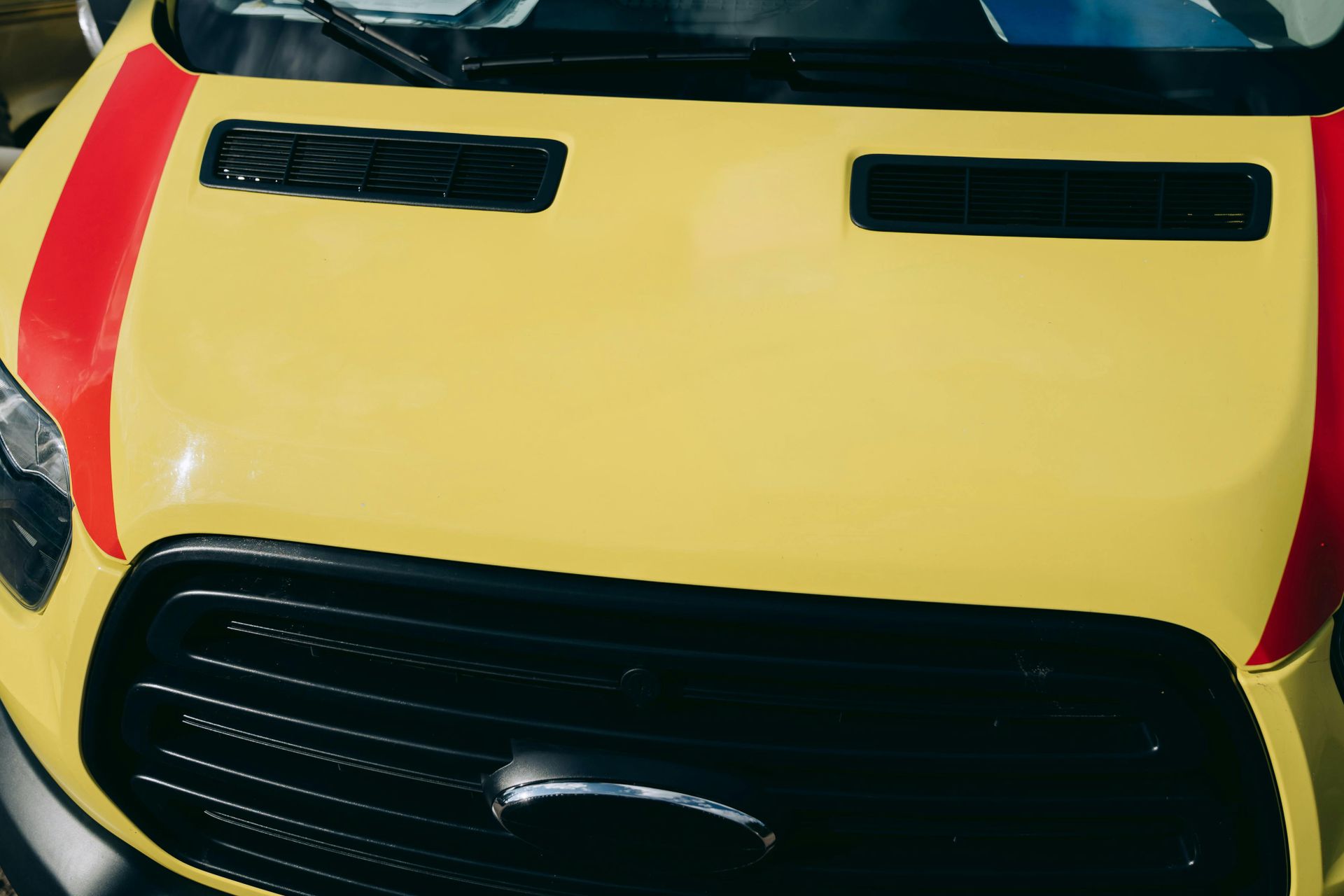 Hood and Grille of a Yellow Ambulance