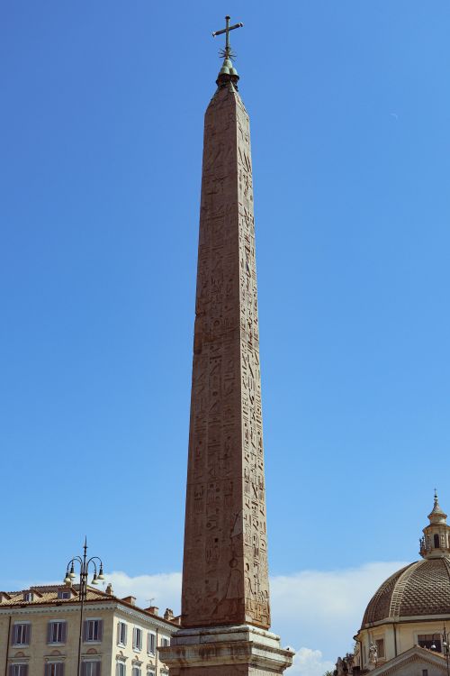 Free Historic Egyptian obelisk in Rome against a clear blue sky, showcasing ancient art. Stock Photo