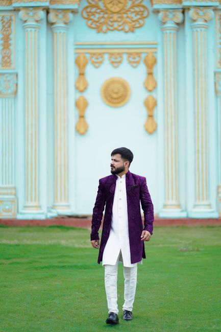 Man posing in traditional Indian attire at a historic Jaipur palace, showcasing cultural elegance. Man posing in traditional Indian attire at a historic Jaipur palace, showcasing cultural elegance.