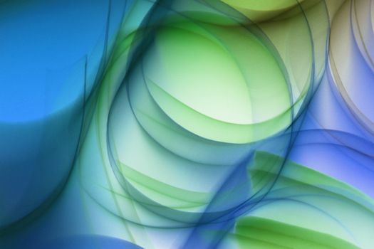 Vibrant abstract image featuring dynamic fluid shapes in blue and green hues, offering a modern artistic touch.