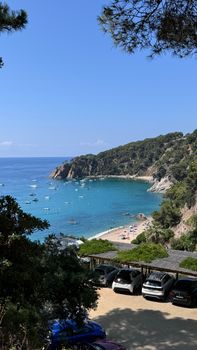 Idyllic view of a secluded beach on Costa Brava, Spain with clear blue water.