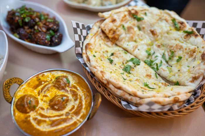 Real chole chickpea curry served with naan and rice