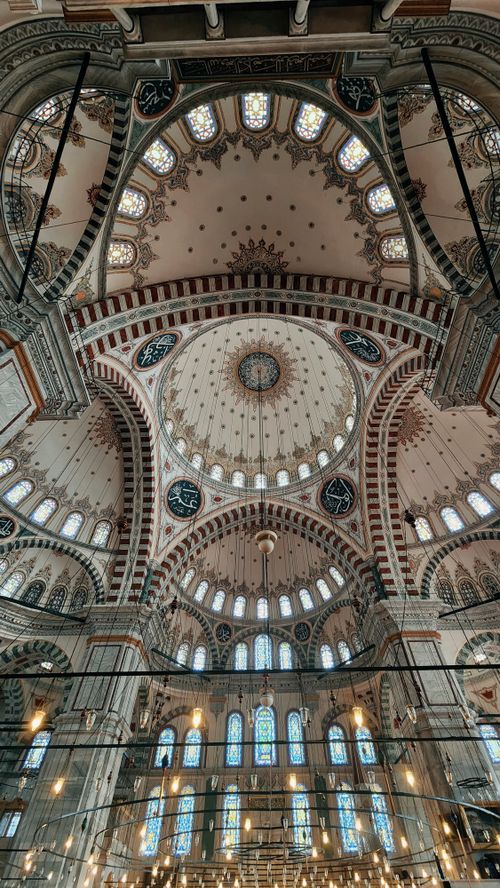 Free Breathtaking interior view of a mosque in Istanbul with an ornate dome and intricate designs. Stock Photo
