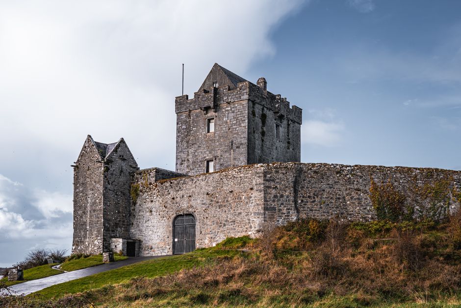 Explore the ancient stone castle in Kinvara, Ireland, surrounded by lush countryside. Explore the ancient stone castle in Kinvara, Ireland, surrounded by lush countryside.