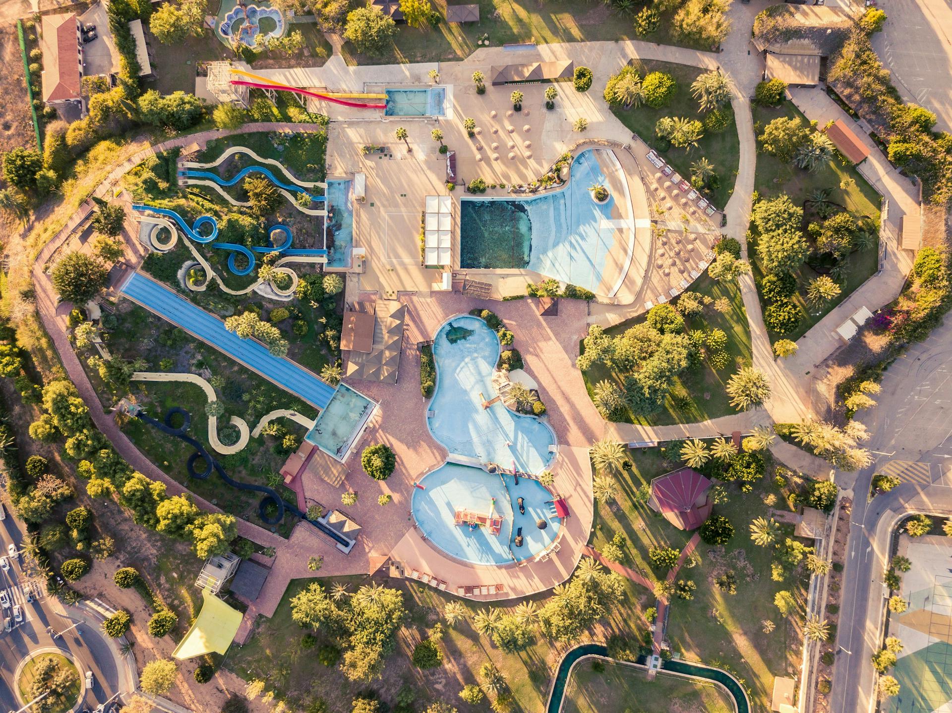 An aerial view of a water park with slides and pools