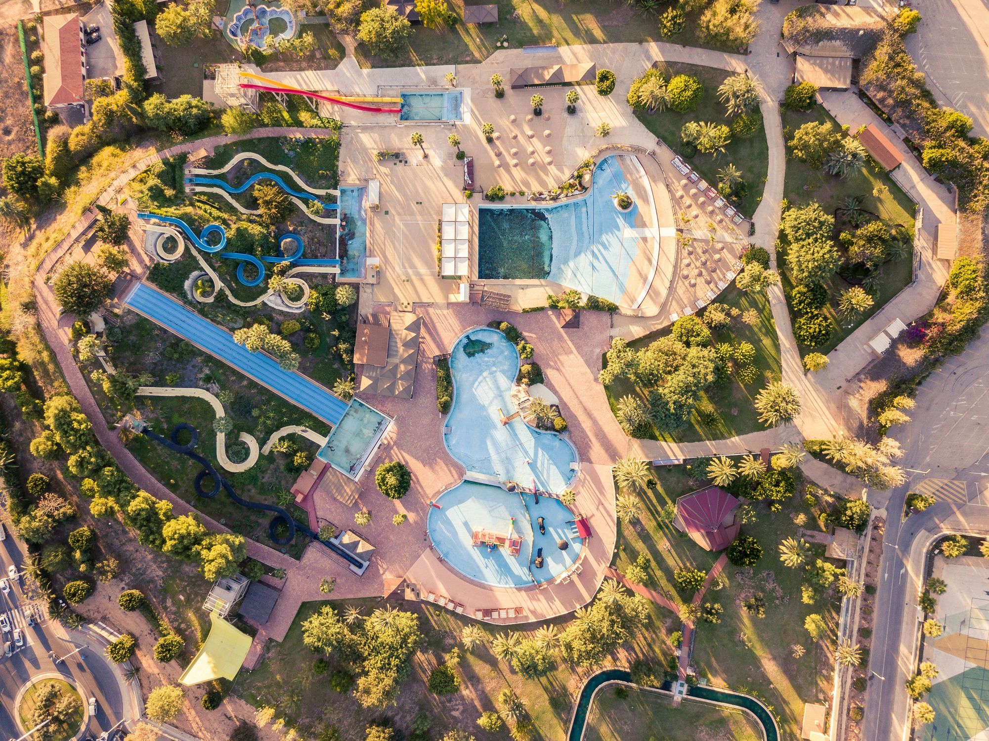 An aerial view of a water park with slides and pools · Free Stock Photo