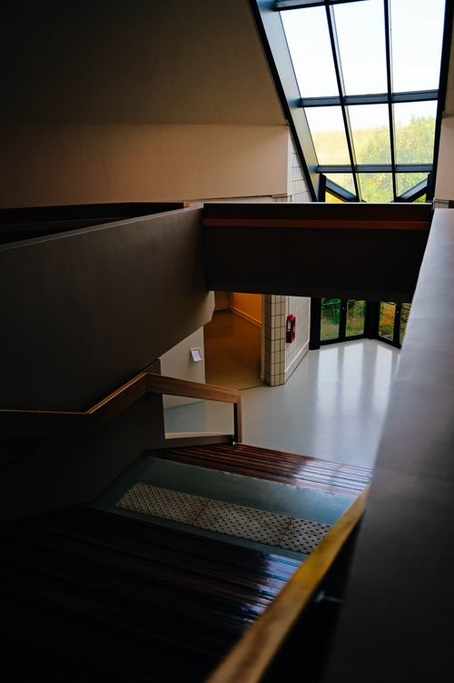 Free Elegant interior staircase design with large skylight and modern architecture. Stock Photo