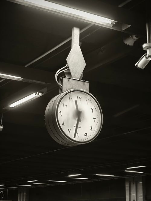 Free A classic black and white image of an analogue clock in a Cairo metro station. Stock Photo