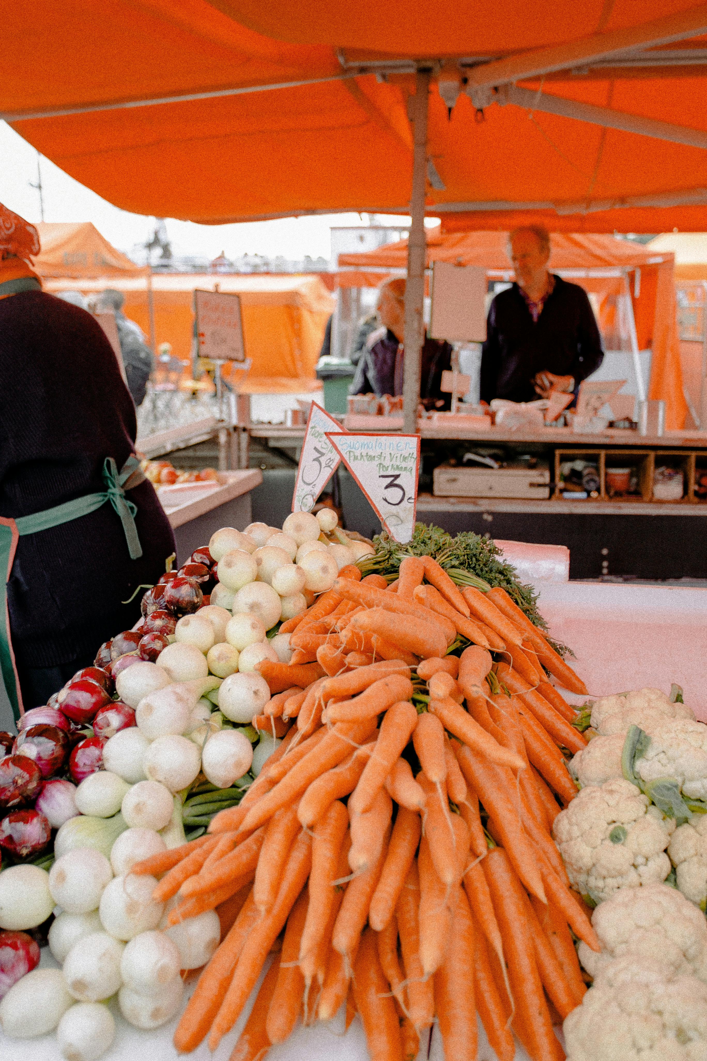 white and orange vegetables under orange canopy