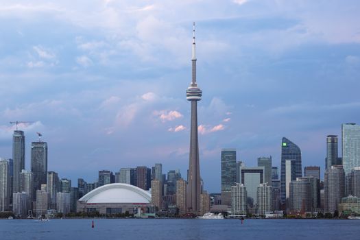 Captivating view of Toronto's skyline featuring the iconic CN Tower at sunset.