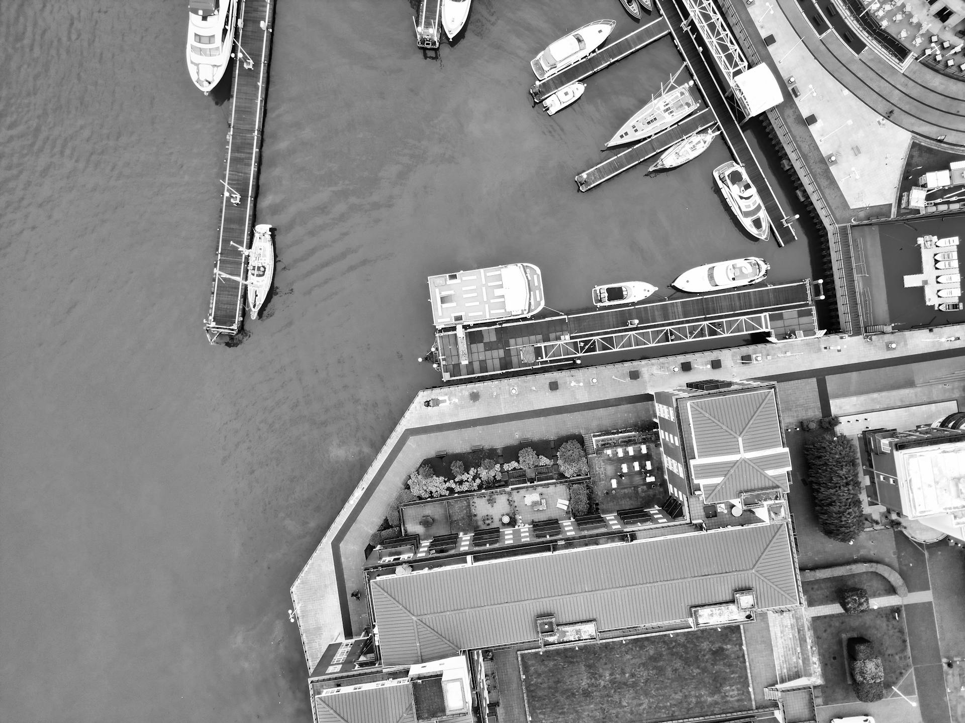 A captivating aerial photograph showcasing boats docked at Portsmouth Marina, England.