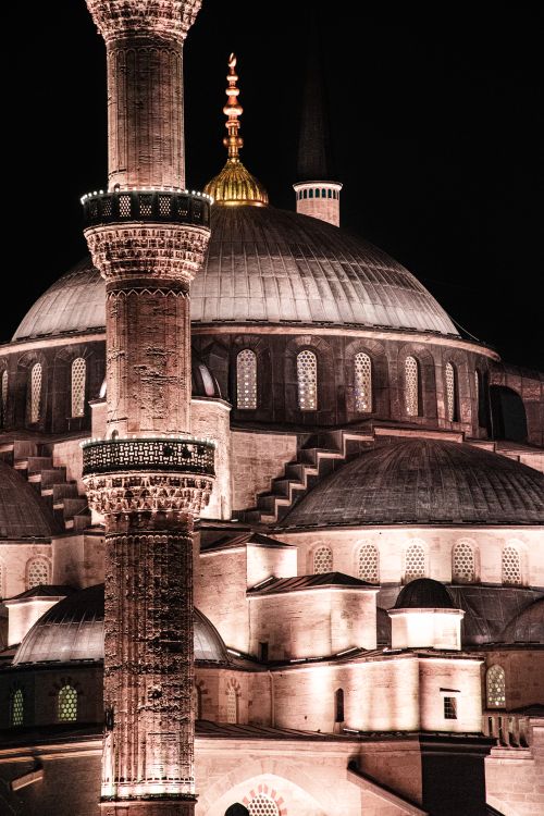 Free Stunning night shot of Sultan Ahmed Mosque showcasing its domes and minarets in Istanbul, Turkey. Stock Photo