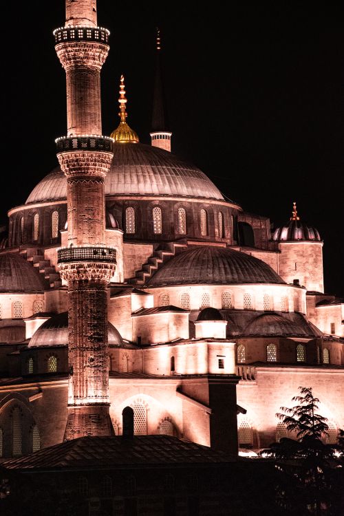 Free Stunning night view of a historic mosque in Istanbul, beautifully illuminated and highlighting its architectural grandeur. Stock Photo