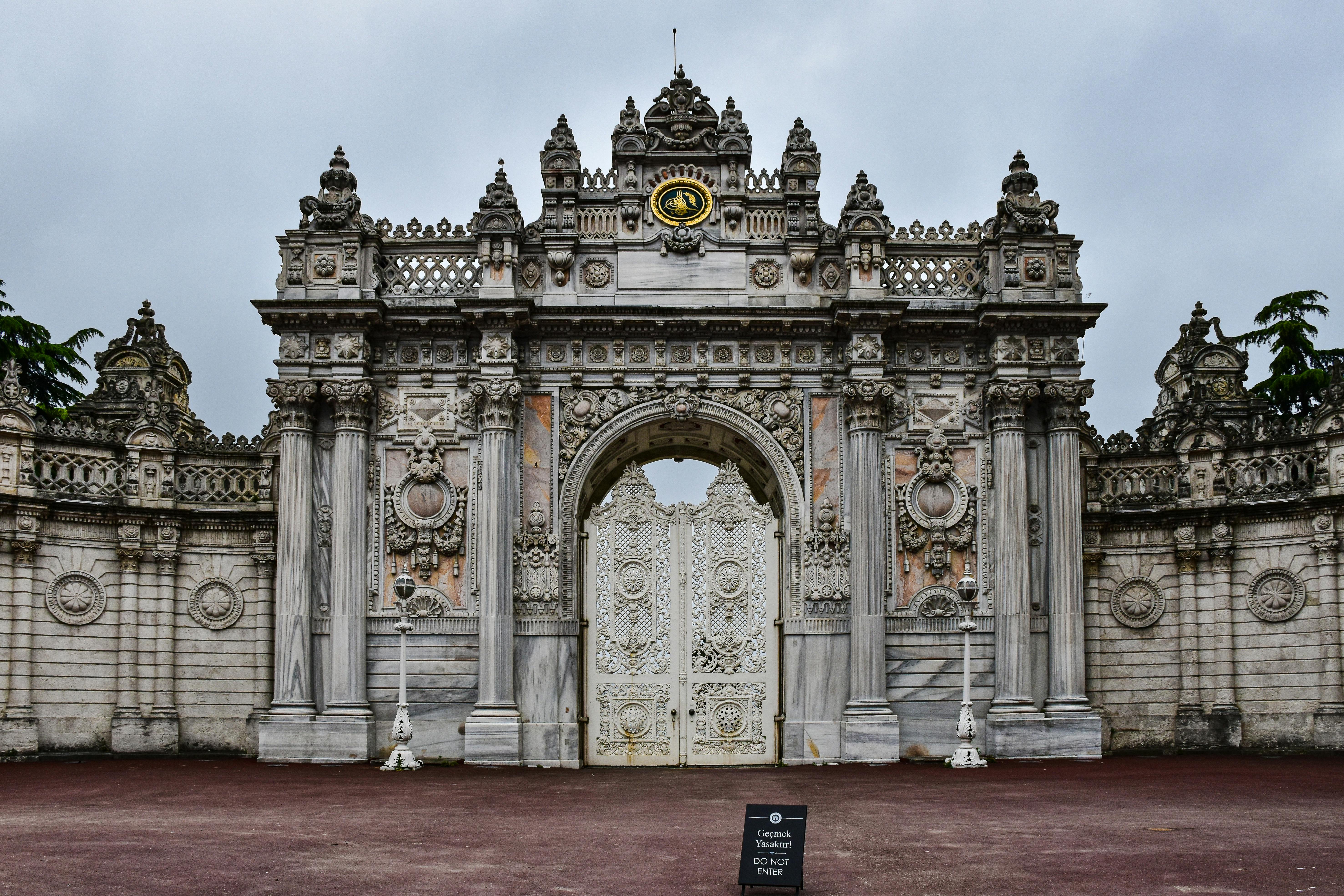 Explore the intricate architecture of the Dolmabahçe Palace gate in Istanbul, a symbol of grandeur and history.
