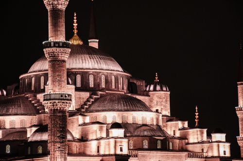 Free Stunning night capture of Istanbul's iconic Blue Mosque showcasing its intricate architecture and illuminated minarets. Stock Photo