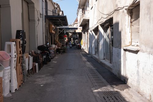 Free A bustling alley in Kemeraltı Bazaar with shops and people on a sunny day in İzmir, Türkiye. Stock Photo