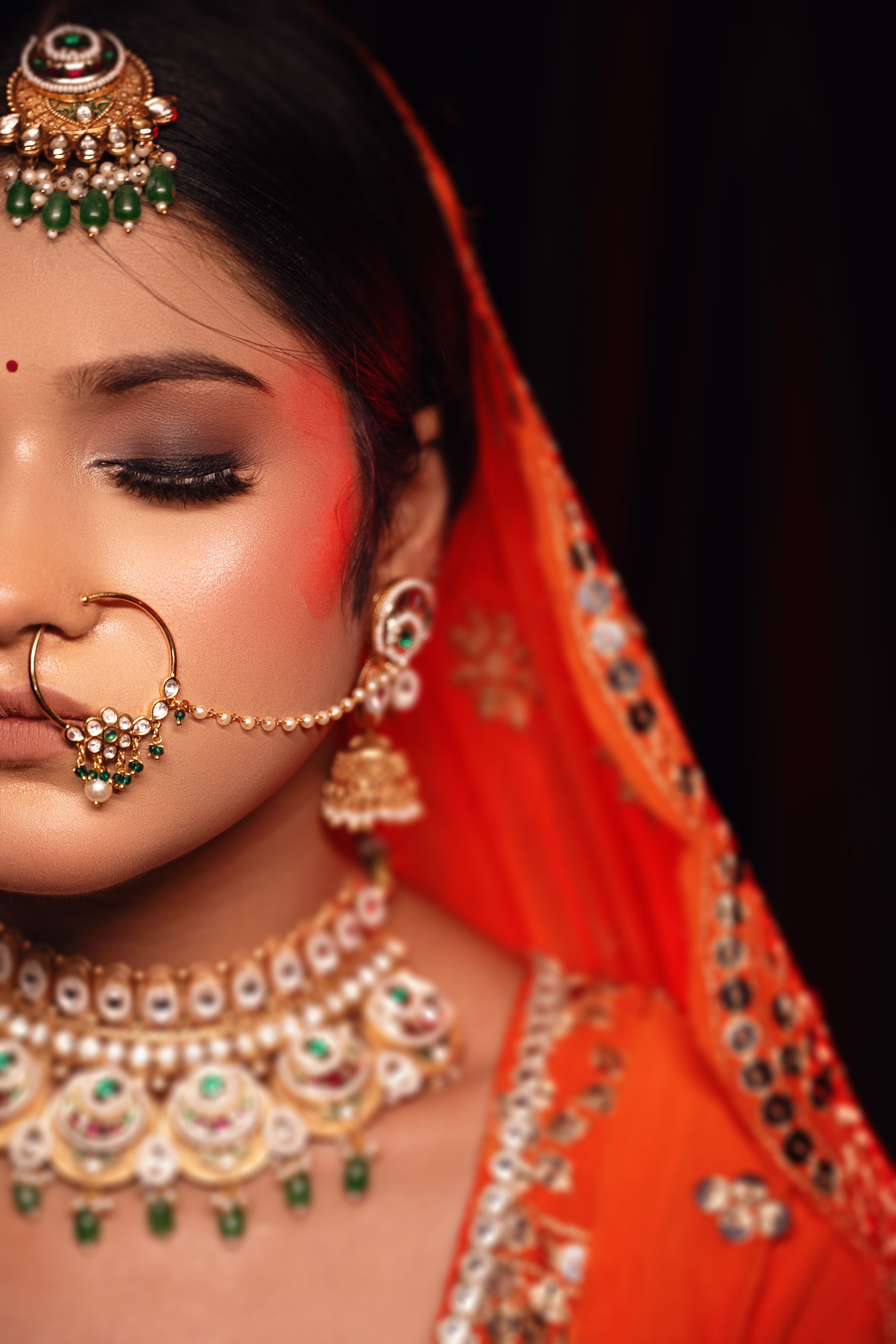 A woman in traditional indian attire with jewelry · Free Stock Photo