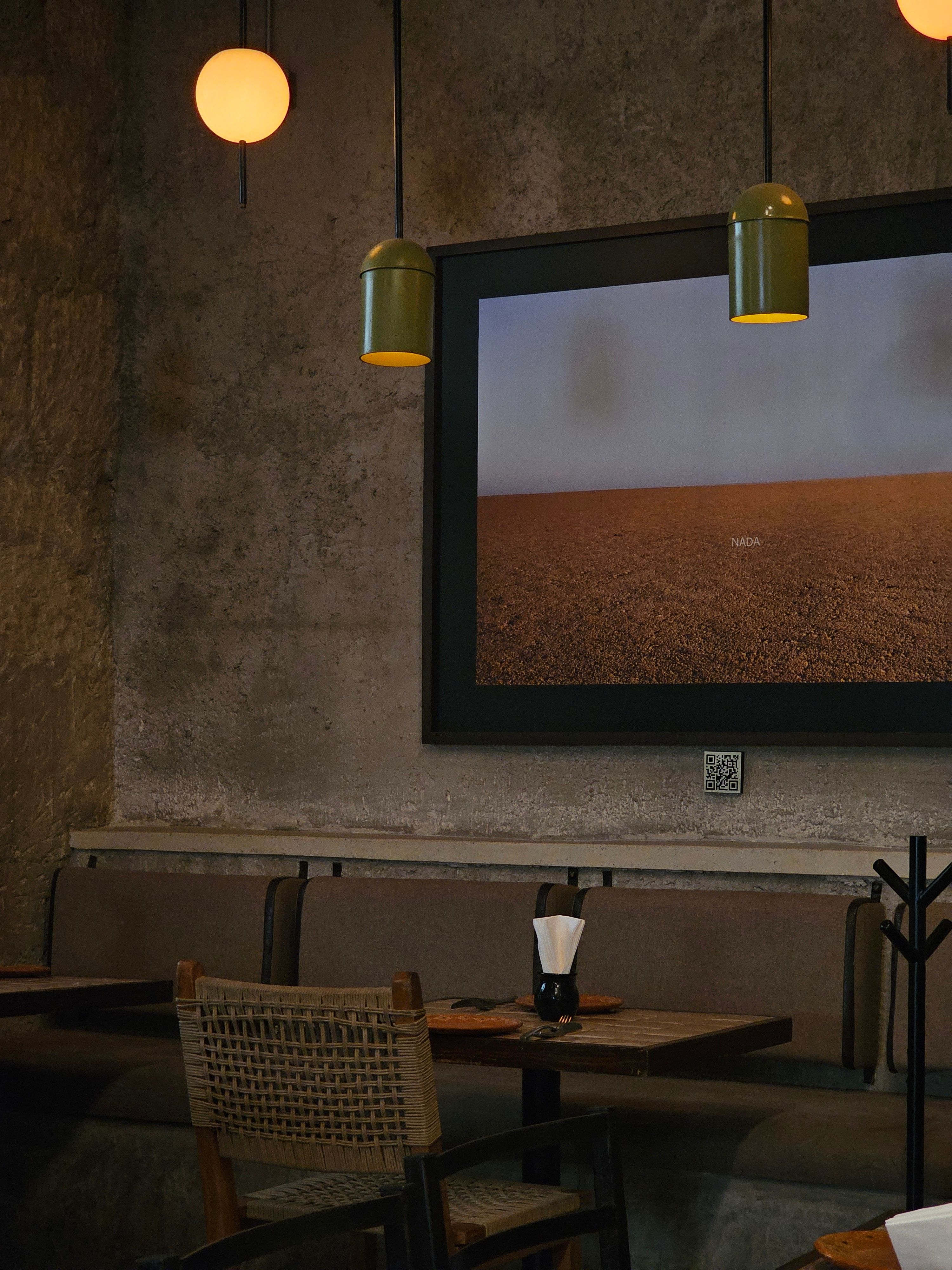 A rustic indoor cafe setting with vintage decor and warm lighting, perfect for intimate gatherings.