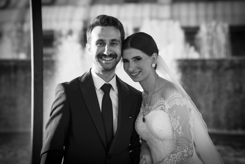 Free Beautiful wedding couple posing outdoors with a fountain backdrop in İstanbul. Stock Photo