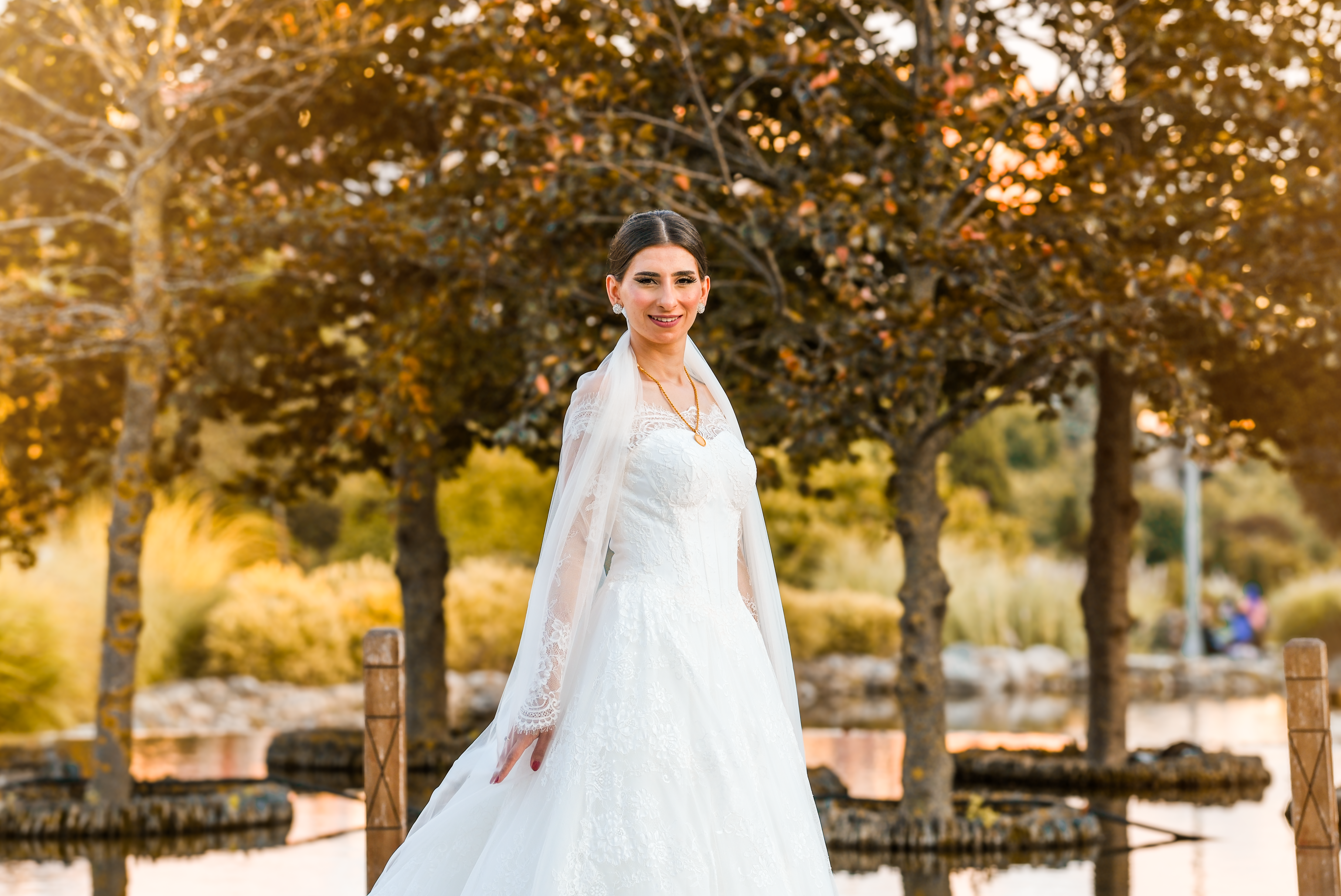 A bride in a white wedding dress poses for a photo · Free Stock Photo