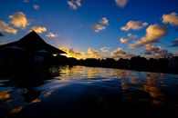Stunning sunset over water with reflection in Calodyne, Mauritius.