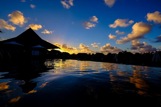 Stunning sunset over water with reflection in Calodyne, Mauritius.