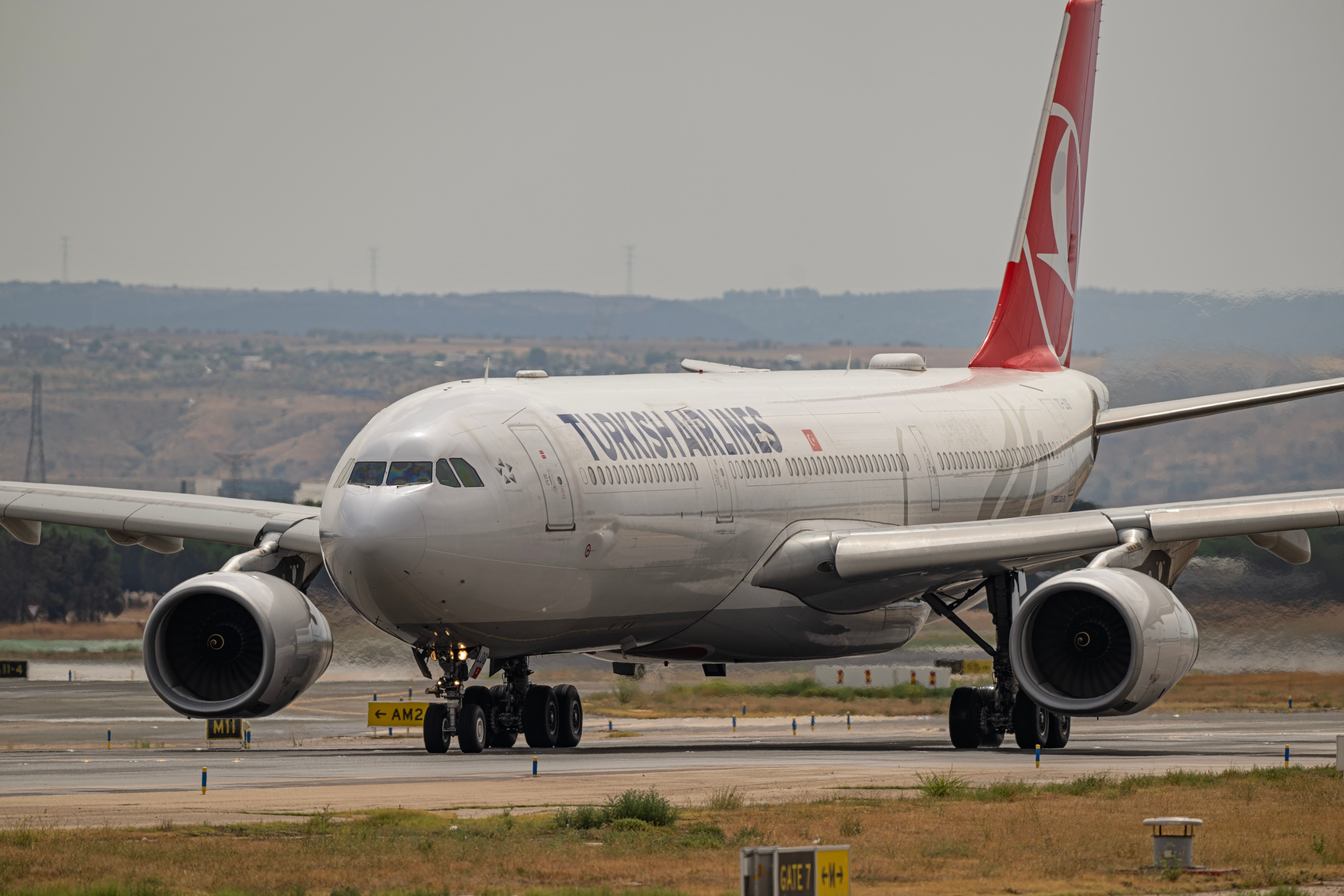 Turkish Airlines Airbus jet prepares for takeoff at Madrid airport. — arriving in Madrid