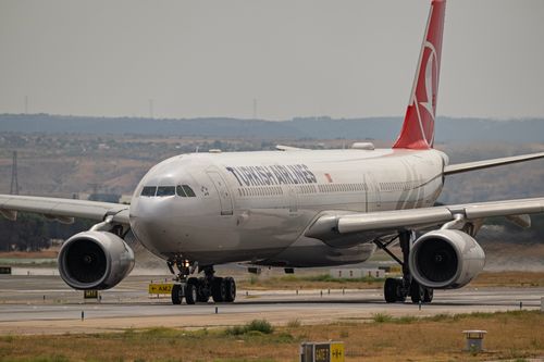 Free Turkish Airlines Airbus jet prepares for takeoff at Madrid airport. Stock Photo