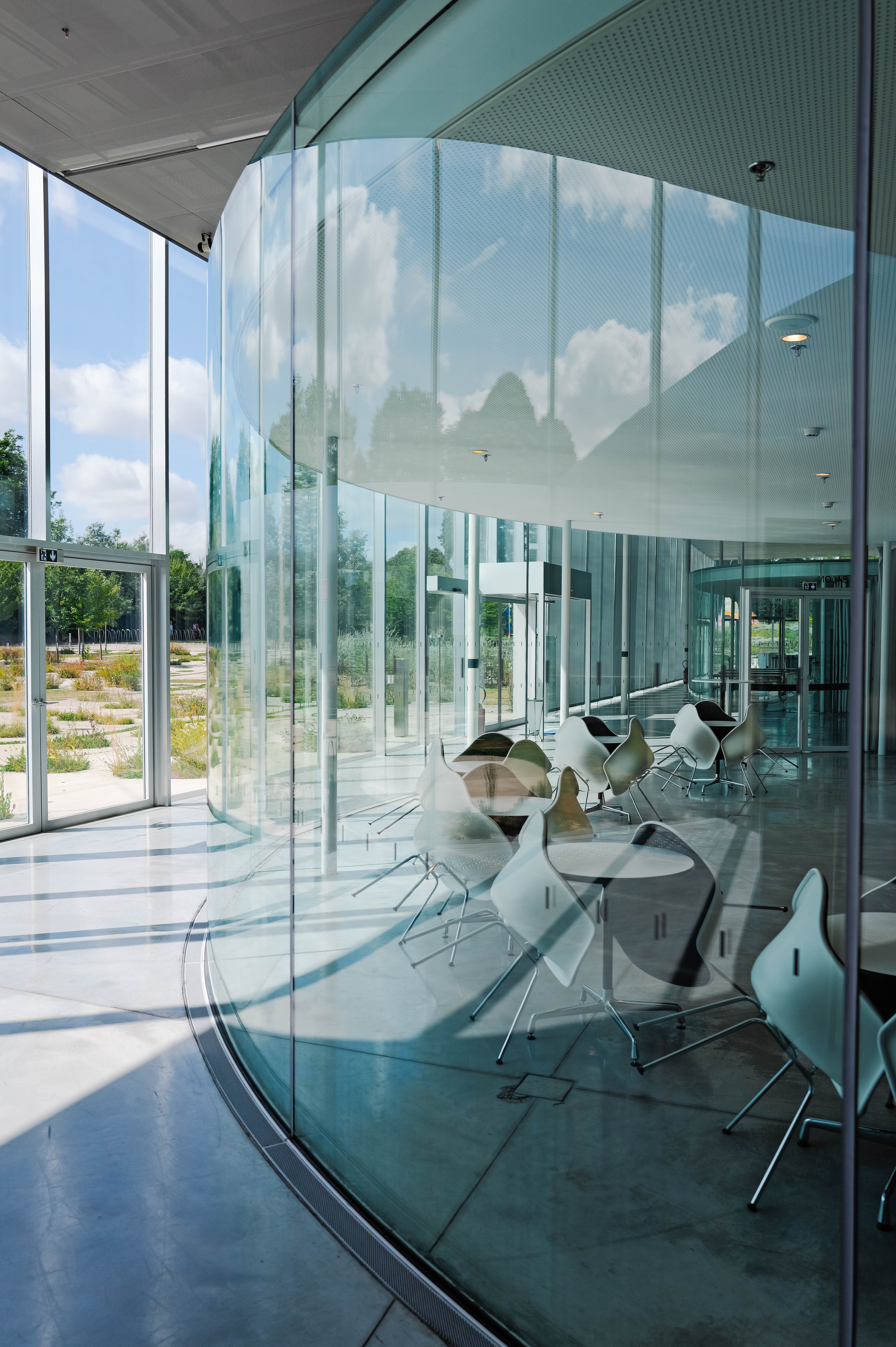 Bright corporate office lobby with glass architecture