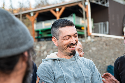A joyful moment between friends captured outdoors, showcasing happiness and camaraderie.