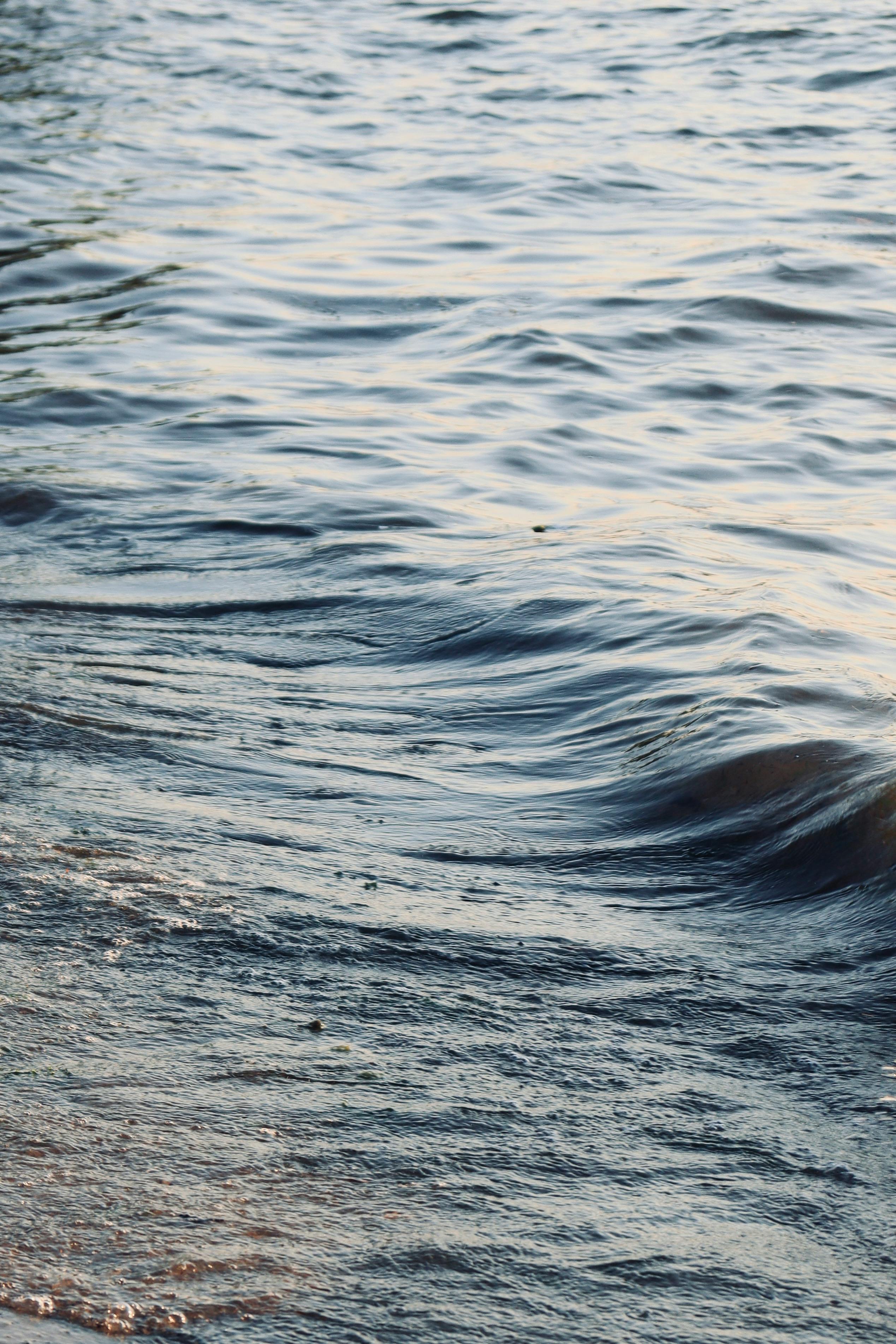 a close up of the water and sand