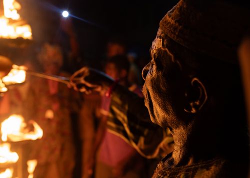 Free A captivating night portrait of a man performing a fire ceremony in Osun, Nigeria. Stock Photo