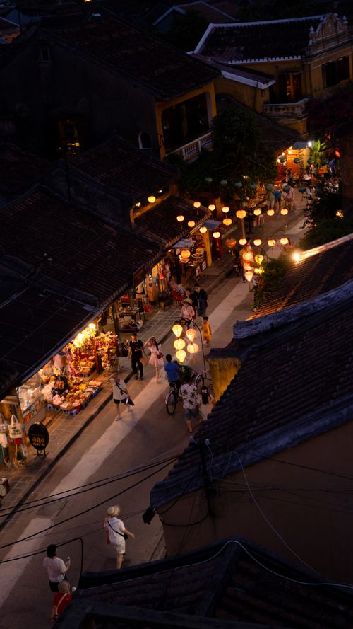 Free Captivating evening scene of Hội An's lantern-lit streets bustling with activity in Vietnam. Stock Photo