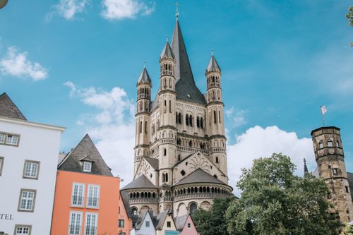 Free Stunning view of a historic church with neo-Gothic architecture under a vibrant blue sky. Stock Photo