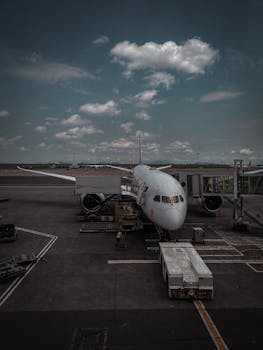 A Boeing 787 at Bole International Airport ready for departure, captured on a cloudy day.