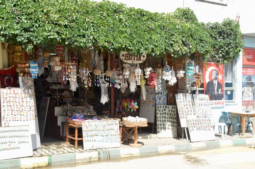 Free Vibrant outdoor market stall featuring diverse souvenirs and local crafts. Stock Photo