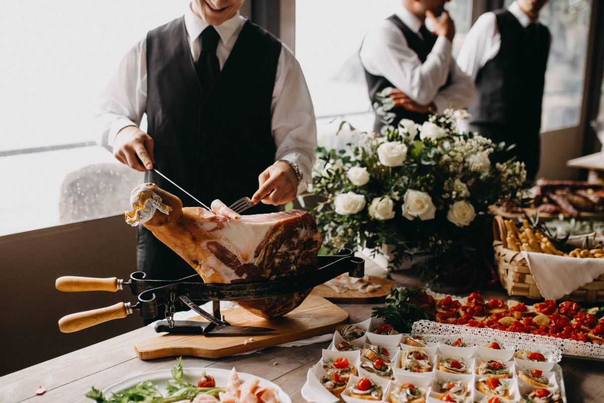 Catering and waiting staff preparing service at an event