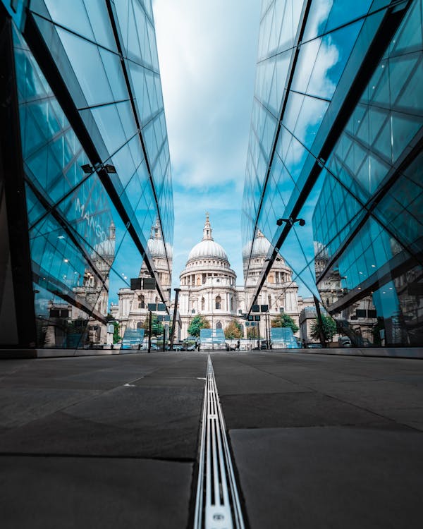 Low Angle Shot of St. Paul's Cathedral Between Glass Buildings