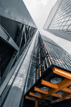 Dynamic view of modern skyscrapers in London, highlighting unique design and perspective.