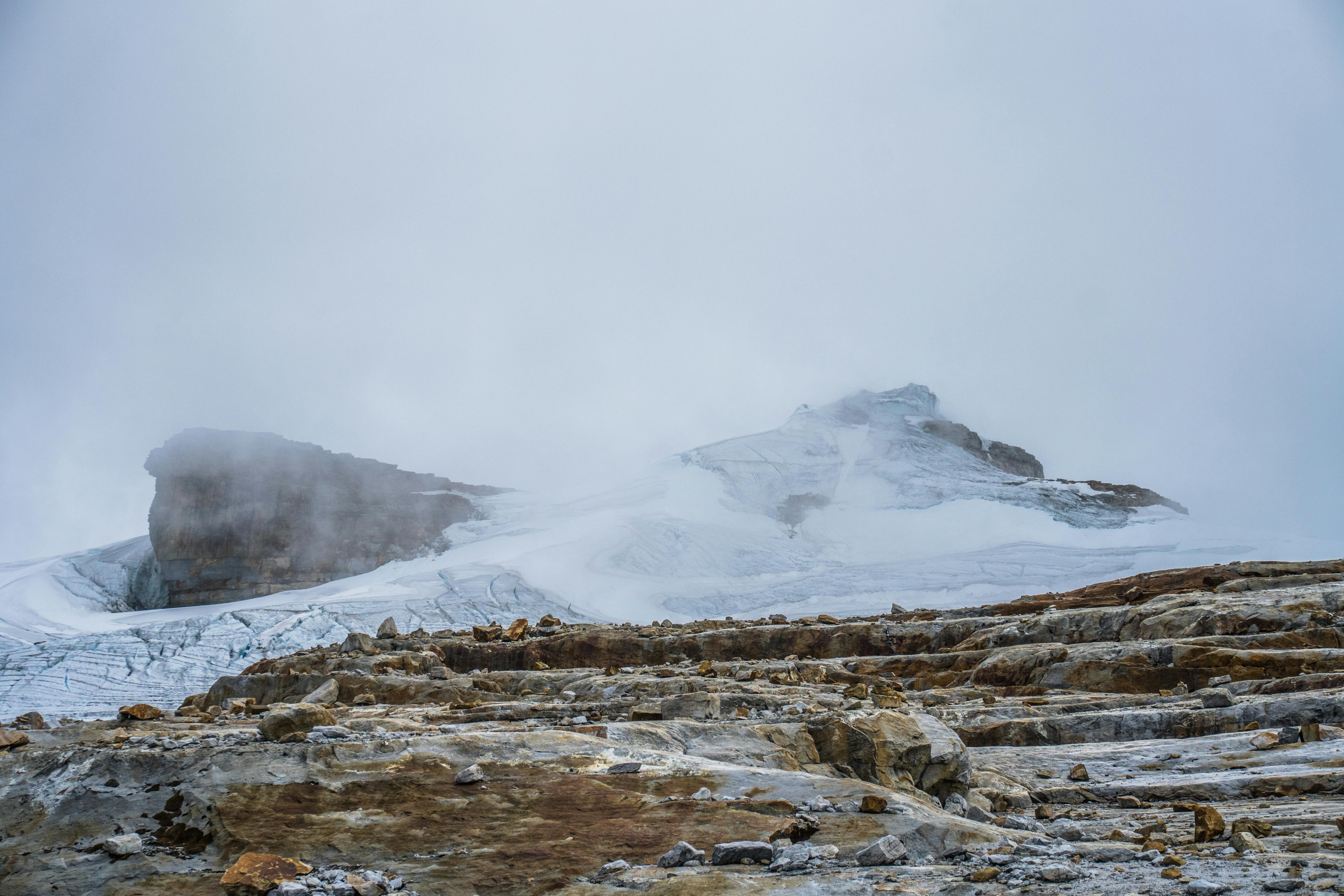 Majestic snowy peaks of El Cocuy National Park in Colombia covered in mist.